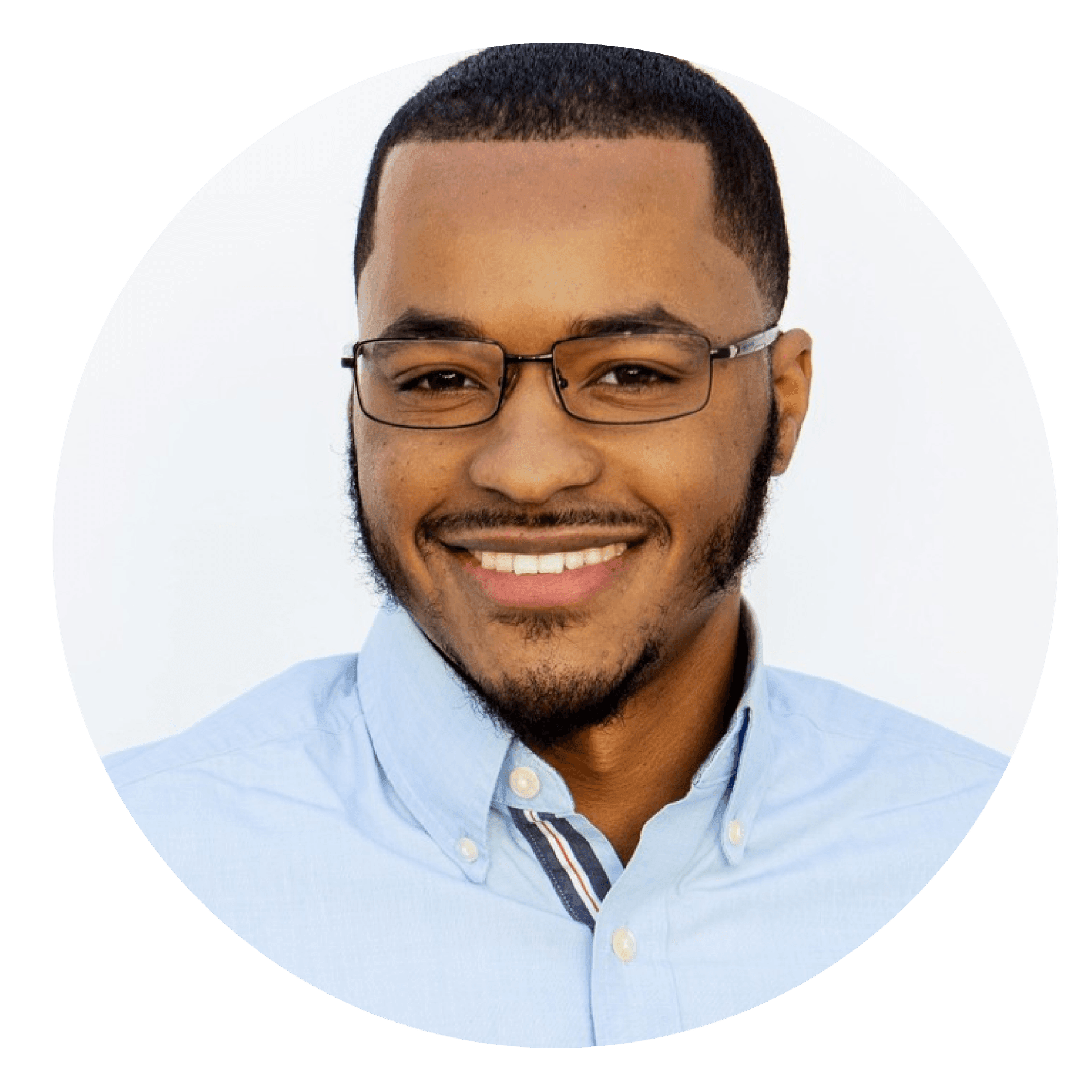 Smiling person wearing glasses and a light blue collared shirt.